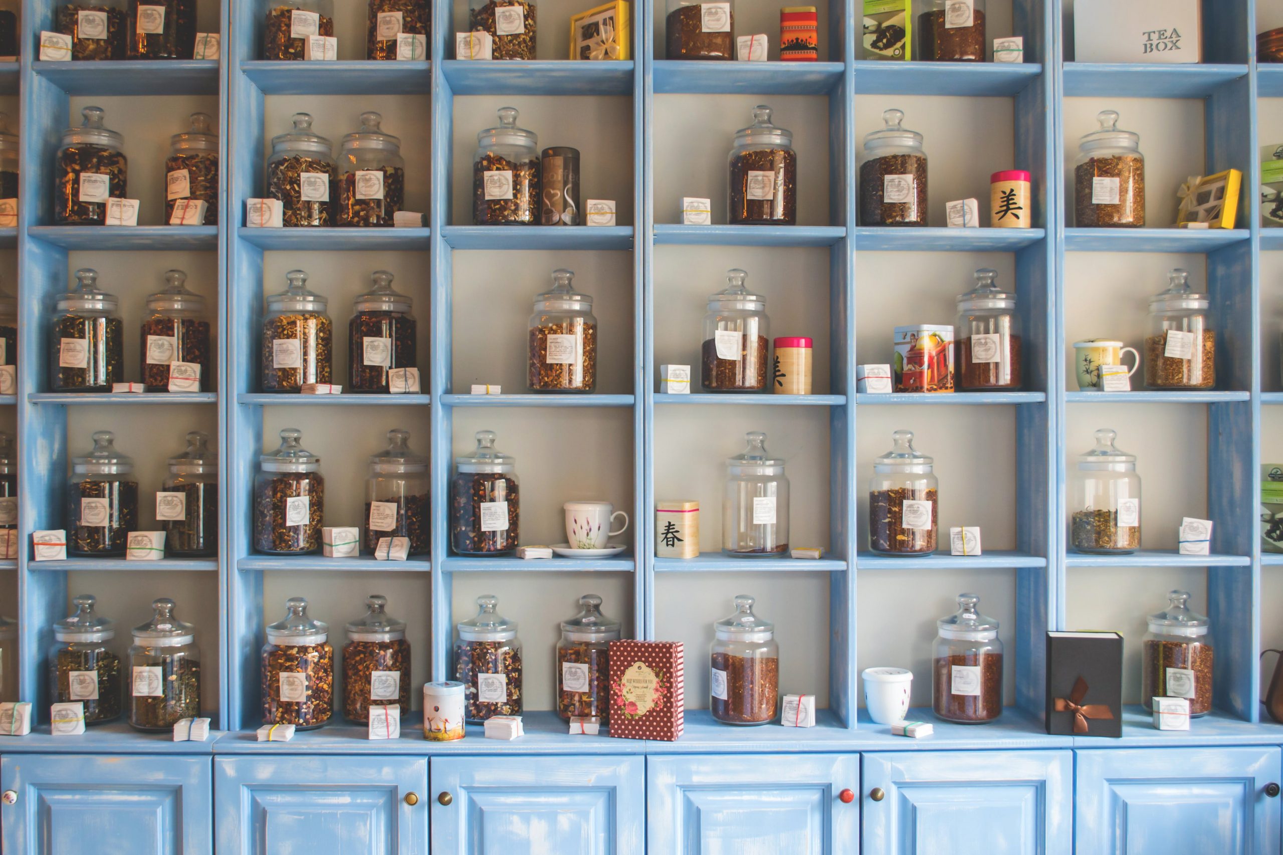 A large set of shelves holding many spices